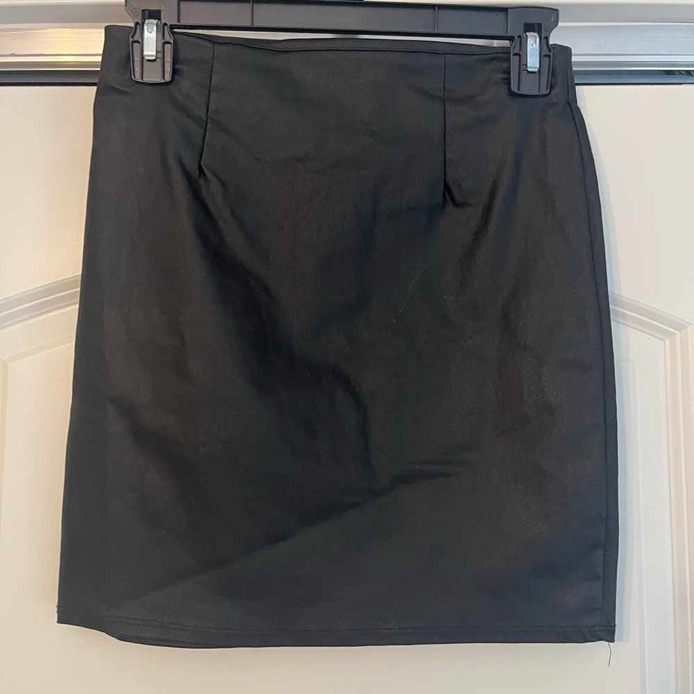 Small black skirt runs more like XS